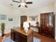 Bright office space with built-in shelving and dark wooden floors at 1727 88Th Nw Ct, Bradenton, FL 34209