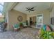 Relaxing covered patio with stylish furniture, ceiling fan, and seamless access to outdoor living at 1727 88Th Nw Ct, Bradenton, FL 34209