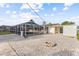 Spacious backyard with screened pool area, and brick pavers at 2070 Carpetgreen St, Port Charlotte, FL 33948