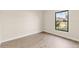Bright bedroom with a large window offers vinyl flooring, neutral walls and abundant natural light at 2070 Carpetgreen St, Port Charlotte, FL 33948