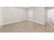 A neutral toned bedroom showcases new flooring, fresh paint, and modern lighting at 2070 Carpetgreen St, Port Charlotte, FL 33948
