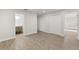 Spacious bedroom with neutral walls, vinyl flooring and closet space, perfect for relaxation and storage at 2070 Carpetgreen St, Port Charlotte, FL 33948