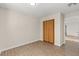 This bedroom offers wood floors, neutral walls and a closet for ample storage at 2070 Carpetgreen St, Port Charlotte, FL 33948