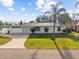Charming single-story home with well-maintained front yard and driveway at 2070 Carpetgreen St, Port Charlotte, FL 33948