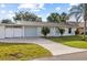 Charming single-story home with well-maintained front yard and driveway at 2070 Carpetgreen St, Port Charlotte, FL 33948
