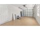 Two car garage with tile flooring and standard garage door at 2070 Carpetgreen St, Port Charlotte, FL 33948