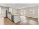 Bright kitchen features granite countertops, stainless steel appliances, and wood-look flooring at 2070 Carpetgreen St, Port Charlotte, FL 33948