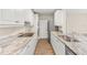 Stylish kitchen with granite countertops, stainless steel appliances, and modern fixtures, with wood flooring at 2070 Carpetgreen St, Port Charlotte, FL 33948