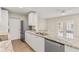 Well-appointed kitchen with granite countertops, stainless steel appliances, and a spacious island for casual dining at 2070 Carpetgreen St, Port Charlotte, FL 33948