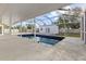 This caged pool offers plenty of space for entertaining at 2070 Carpetgreen St, Port Charlotte, FL 33948