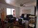 Living room featuring a ceiling fan, a rug, and two brown recliners at 220 29Th E St, Palmetto, FL 34221