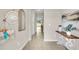 Inviting entryway features neutral colors, tile flooring, and stylish decor at 2473 Mellow Ln, Clearwater, FL 33765