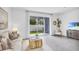 Bright living room showcases tile floors, backyard access, and neutral paint, great for relaxing and entertaining at 2481 Mellow Ln, Clearwater, FL 33765