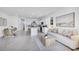 Open concept living space boasts natural light, modern decor, and a spacious kitchen, perfect for entertaining at 2481 Mellow Ln, Clearwater, FL 33765
