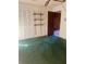 Bedroom with green carpet, closet, and natural light from the large window at 2712 52Nd Avenue W Ter, Bradenton, FL 34207