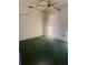 Bedroom featuring ceiling fan, window with coverings and green carpet at 2712 52Nd Avenue W Ter, Bradenton, FL 34207