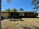 Charming home featuring palm trees, a well-maintained lawn, and inviting curb appeal at 2712 52Nd Avenue W Ter, Bradenton, FL 34207