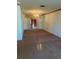 Spacious living room featuring chandelier, neutral carpet, and access to patio at 2712 52Nd Avenue W Ter, Bradenton, FL 34207