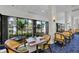 Elegant restaurant with scenic views and well-appointed dining tables at 27454 Hole In One Pl, Englewood, FL 34223