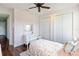 Bedroom featuring light pink walls, hardwood floors, and white trim, and a double door closet at 30416 Saddlebag Trl, Myakka City, FL 34251