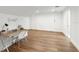 Versatile bonus room with sleek wood floors, ample natural light, and a functional desk setup at 30416 Saddlebag Trl, Myakka City, FL 34251