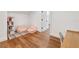 Bonus room features hardwood floors, two beanbag chairs, a bookshelf, and closet access at 30416 Saddlebag Trl, Myakka City, FL 34251