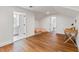 Bright bonus room with hardwood floors, two beanbag chairs, and an attached bathroom and closet space at 30416 Saddlebag Trl, Myakka City, FL 34251