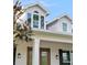 Close-up of the home's exterior, showing dormer windows and a covered porch at 30416 Saddlebag Trl, Myakka City, FL 34251