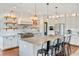 Bright kitchen featuring modern appliances and a large center island at 30416 Saddlebag Trl, Myakka City, FL 34251