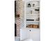 Charming built-in shelving unit and brick fireplace add character to this cozy living space at 30416 Saddlebag Trl, Myakka City, FL 34251