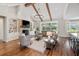 Bright living room with fireplace, built-ins, hardwood floors, exposed beams and an open concept design at 30416 Saddlebag Trl, Myakka City, FL 34251