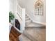 Carpeted staircase featuring a built-in wine rack and decorative wall decor at 30416 Saddlebag Trl, Myakka City, FL 34251