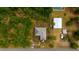The property is seen from directly above with surrounding trees at 3320 Audette St, Port Charlotte, FL 33948