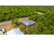 A high angle view shows the home surrounded by trees at 3320 Audette St, Port Charlotte, FL 33948