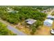 Aerial view of a home nestled amongst lush greenery at 3320 Audette St, Port Charlotte, FL 33948
