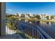 Scenic balcony view overlooking a tranquil waterway and well-maintained white condominiums on a bright, sunny day at 3420 77Th W St # 202, Bradenton, FL 34209
