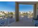 Balcony view of tranquil lake, beautiful community buildings, and lush palm trees, perfect for relaxation at 3420 77Th W St # 202, Bradenton, FL 34209