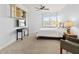 Bedroom featuring a ceiling fan, display shelving, and comfortable furnishings, perfect for relaxation at 3420 77Th W St # 202, Bradenton, FL 34209