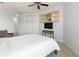 Bedroom featuring a ceiling fan, display cabinet, and comfortable furnishings creating a cozy retreat at 3420 77Th W St # 202, Bradenton, FL 34209