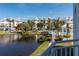 Exterior view of community showcasing lake, pool, palm trees, and manicured lawns, offering an inviting lifestyle at 3420 77Th W St # 202, Bradenton, FL 34209