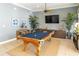 Spacious game room featuring a classic pool table, stylish decor, and ample seating for entertainment at 3420 77Th W St # 202, Bradenton, FL 34209