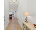 Inviting hallway with neutral decor, tile flooring, and a glimpse of the living area at 3420 77Th W St # 202, Bradenton, FL 34209