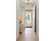 Bright hallway with tile flooring and a view of the outdoor balcony through an open door at 3420 77Th W St # 202, Bradenton, FL 34209