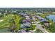 Aerial view of property showcasing the pool, golf course and lake views at 3725 Spyglass Hill Rd, Sarasota, FL 34238