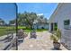 A gorgeous backyard patio space featuring an outdoor seating arrangement and fire pit at 3725 Spyglass Hill Rd, Sarasota, FL 34238