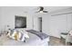 Inviting bedroom features a comfortable bed, ceiling fan, closet, and neutral decor, creating a serene atmosphere at 3725 Spyglass Hill Rd, Sarasota, FL 34238