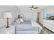Comfortable bedroom featuring a cozy bed, closet, and scenic window for plenty of natural light at 3725 Spyglass Hill Rd, Sarasota, FL 34238