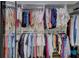 Walk-in closet with organized hanging racks and shelves, maximizing storage and accessibility at 3725 Spyglass Hill Rd, Sarasota, FL 34238