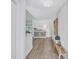 Inviting foyer with hardwood floors, modern decor, and bright, neutral color palette that leads into the living spaces at 3725 Spyglass Hill Rd, Sarasota, FL 34238