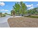 Scenic view of a wooden bridge surrounded by mature trees and landscaped grounds within a serene community setting at 3725 Spyglass Hill Rd, Sarasota, FL 34238